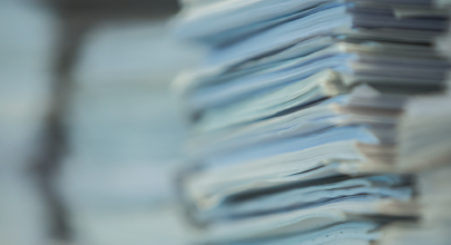 A close up of a large stack of papers